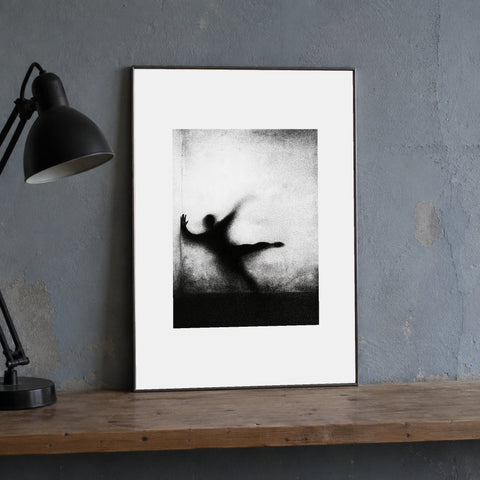 Counterform Print, 30 × 40 cm (11.81 × 15.75 in), beside a black task lamp on a worn shelf. Mockup; print sold unframed.