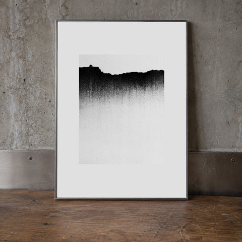 Dissolve Print, 30 × 40 cm (11.81 × 15.75 in), leaning on a walnut surface. Mockup; print sold unframed.