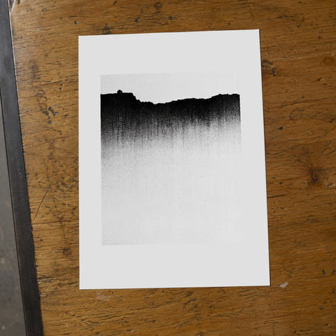 Dissolve Print, A4: 21 × 29.7 cm (8.27 × 11.69 in), unframed on a worn ash tabletop. Mockup; print sold unframed.